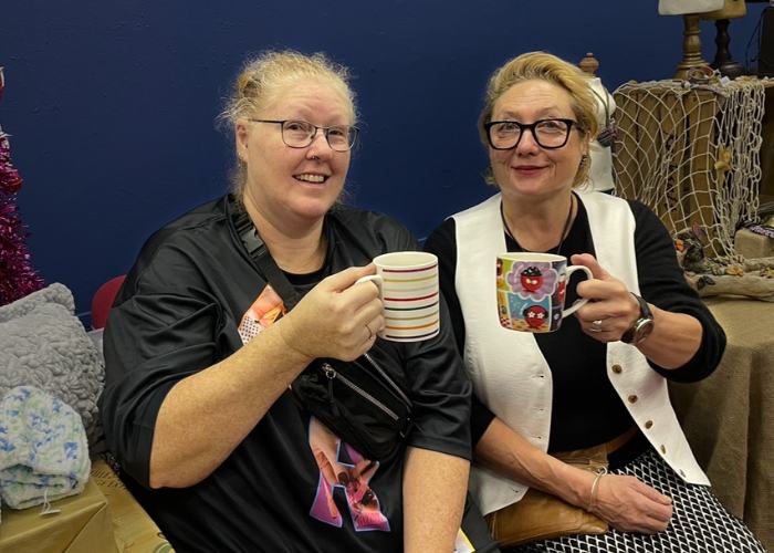 two women drink teak together