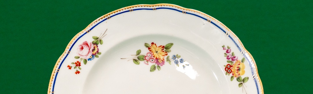 Detail of a plate from, decorated with sprigs of flower
