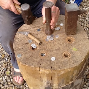 A man minting coins