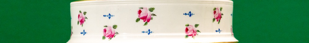 Detail of a ceramic ice pail decorated with roses