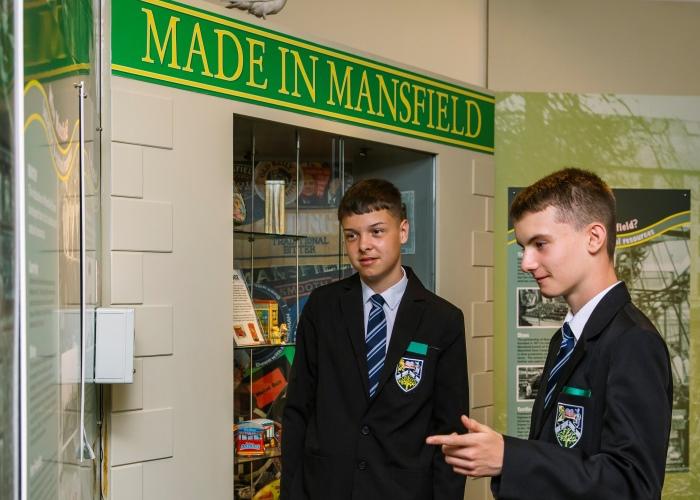 Two students viewing a museum exhibition