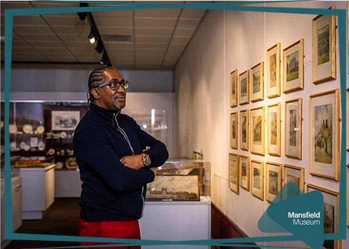 Photo of a visitor viewing one of the museums exhibitions