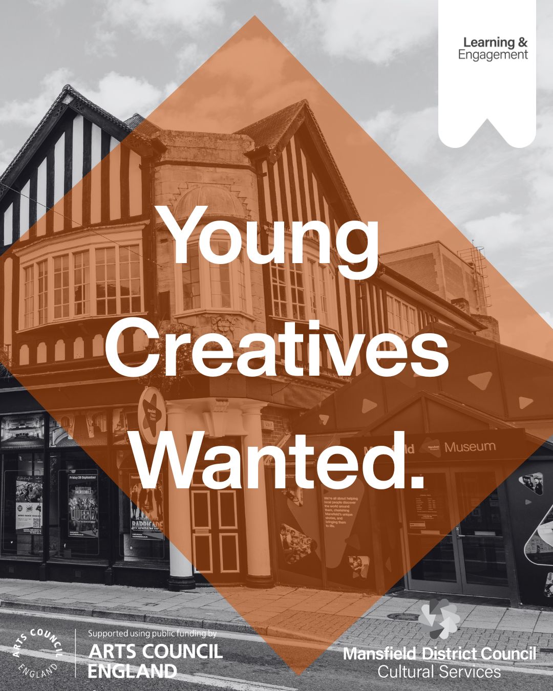 A greyscale image of Mansfield Museum and Mansfied Palace theatre. There is an orange rectangle in the middle of the photo with the text Young Creatives Wanted. In large white letters in the middle