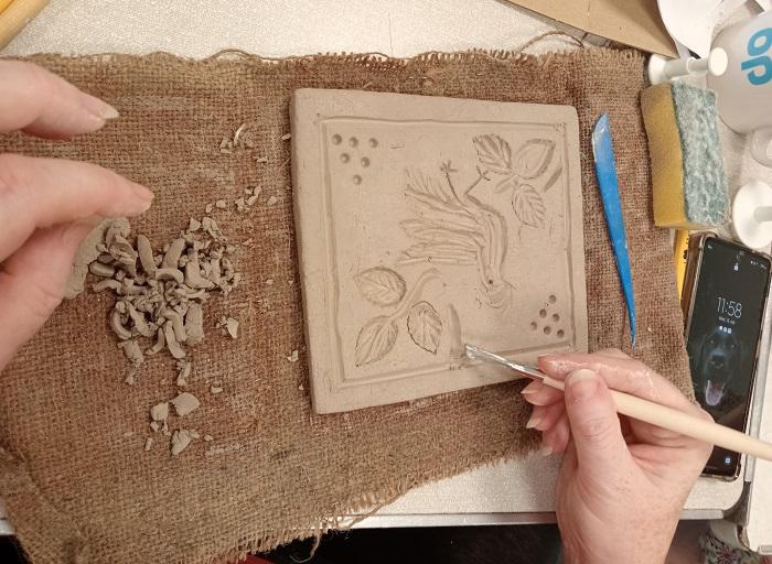 hands creating a tile