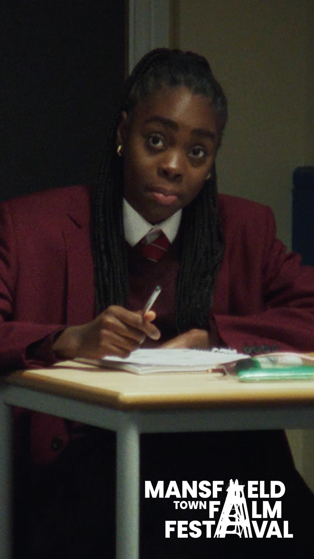 Girl sits at desk